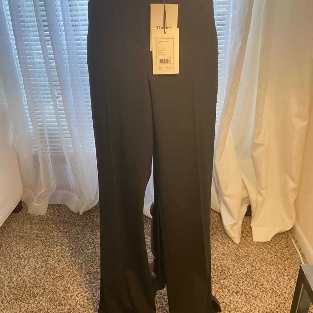 Hook-and-eye closure, belt loops. Off-seam front pockets,small size 14.